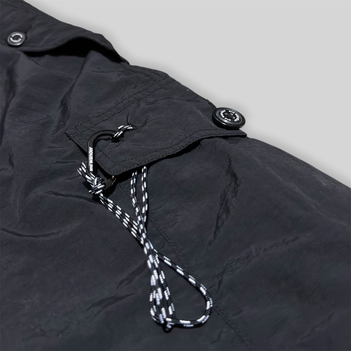 and wander Japan Men's Oversized Utility Belted Parachute Cargo Pants (Lightweight Water Repellent Ripstop Nylon Blend Multipocket Outdoor/Hiking Pants) in Black