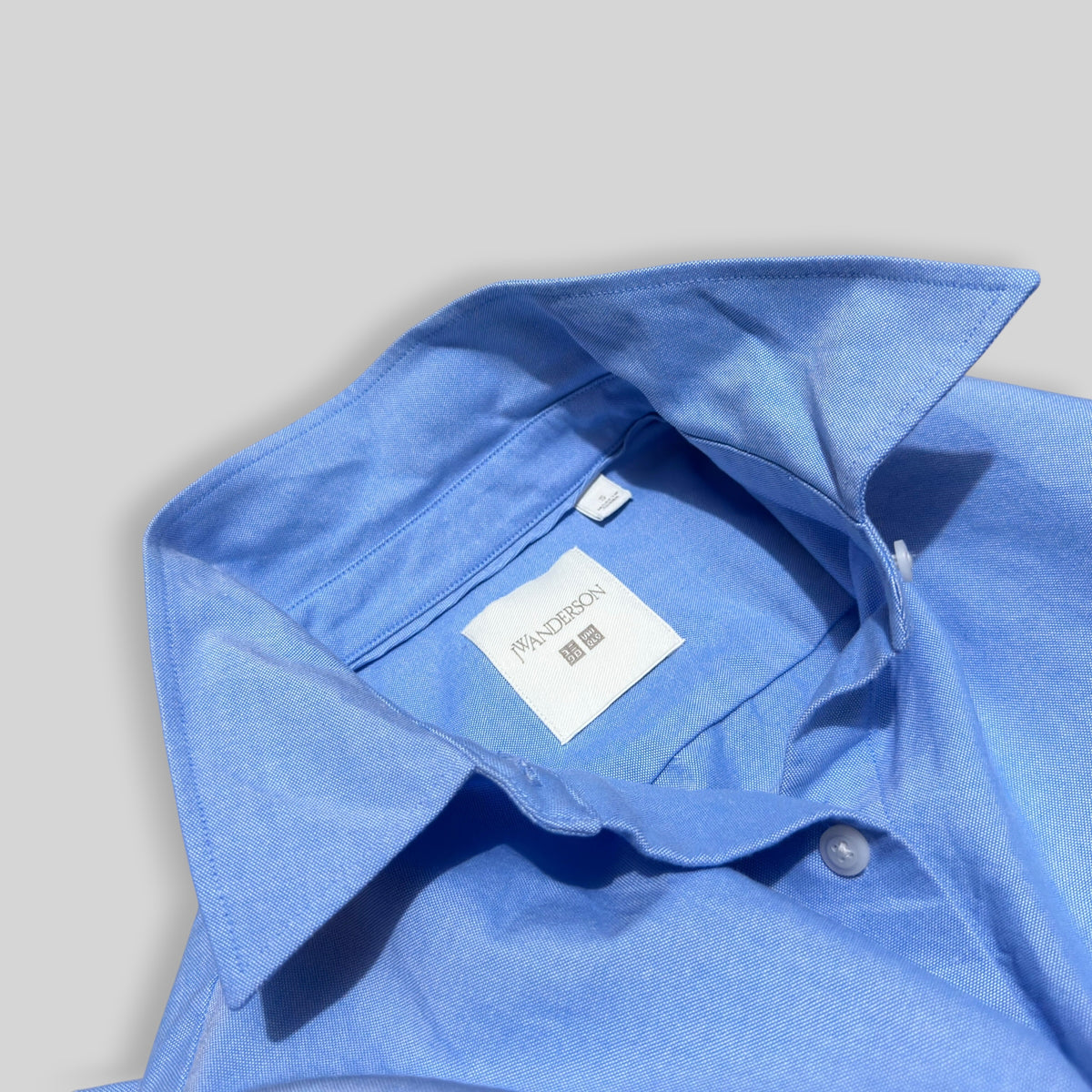 UNIQLO x JW Anderson Unisex Oxford Boxy/Cropped Short Long Sleeve Shirt in Blue